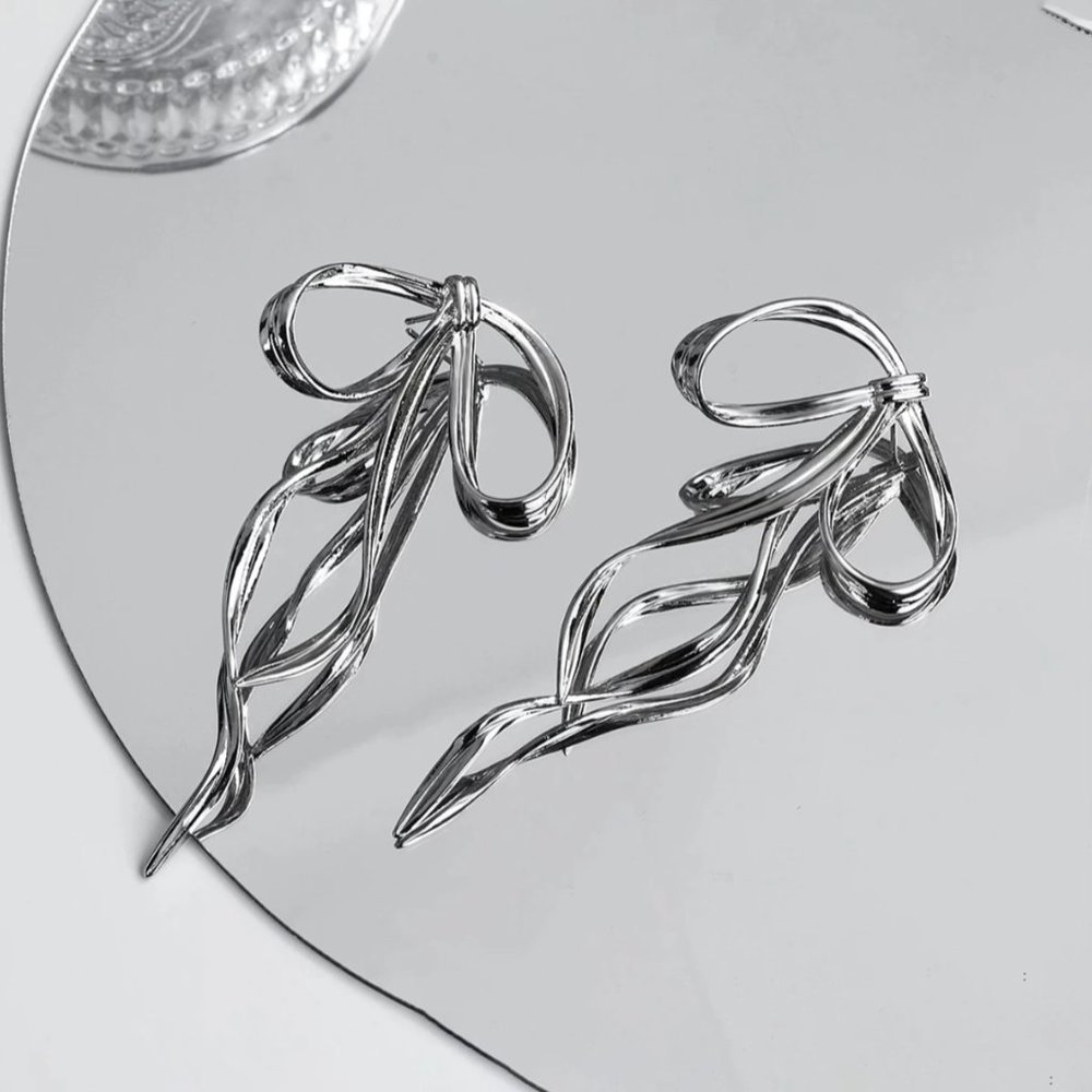 Anthro Silver Bow Earring - Picture 2 of 9
